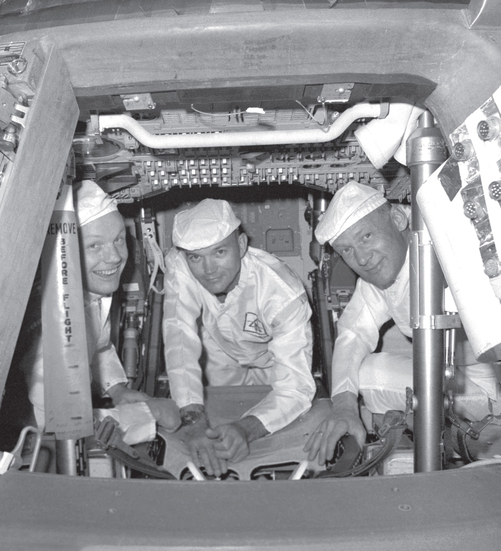 Astronauts Neil Armstrong Michael Collins and Buzz Aldrin in the hatchway of - photo 6