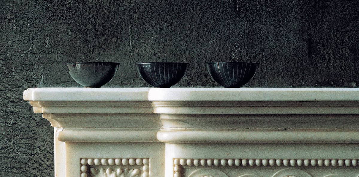 Three small ceramic bowls create an asymmetrical focus on one side of a - photo 7