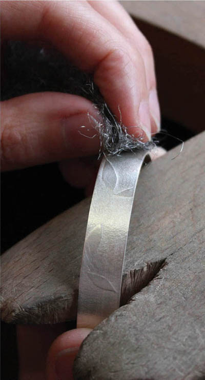 Finishing a silver bracelet using wire wool This book describes many of the - photo 5