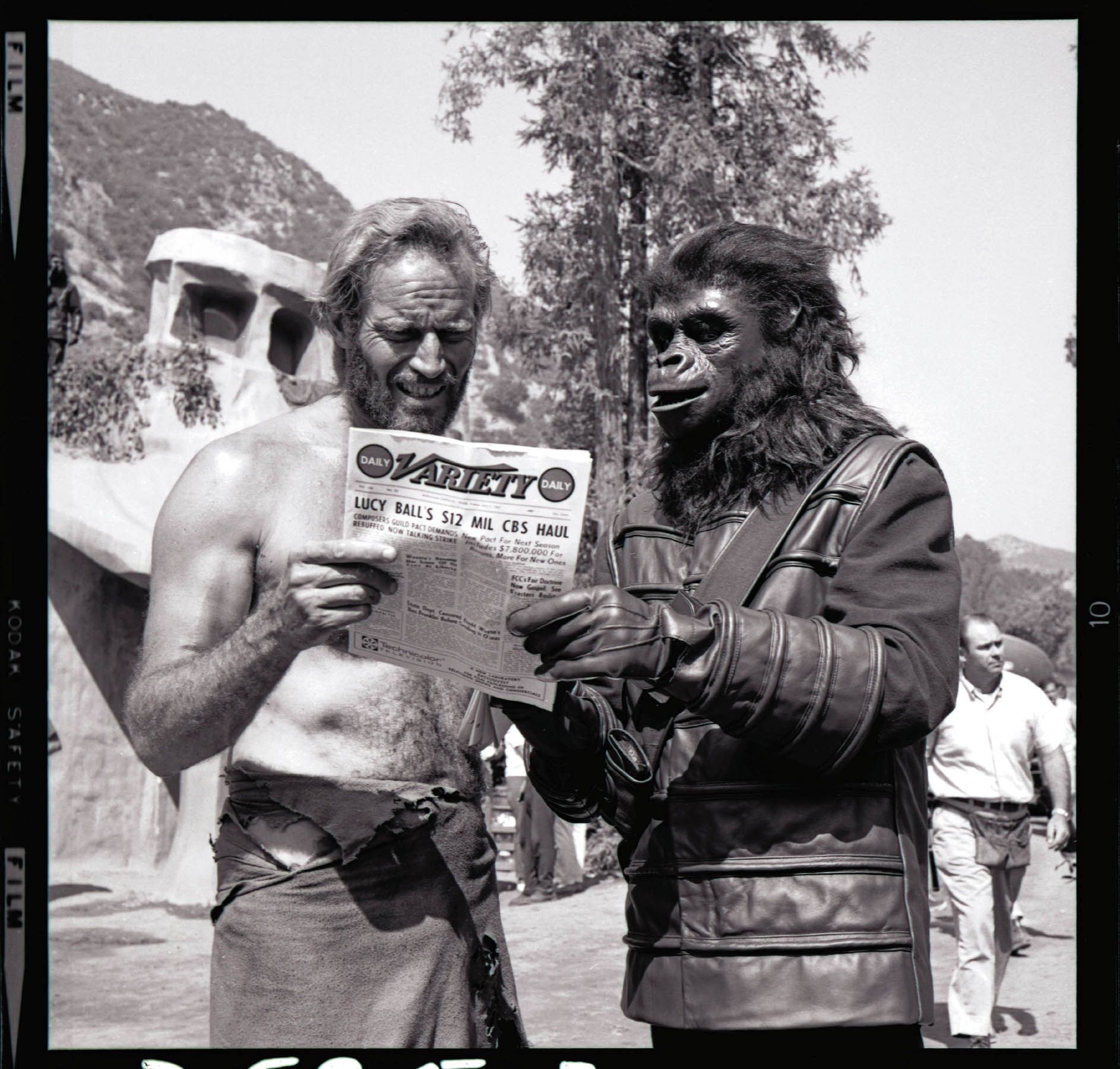 Between takes the star of Planet of the Apes Charlton Heston reads industry - photo 1