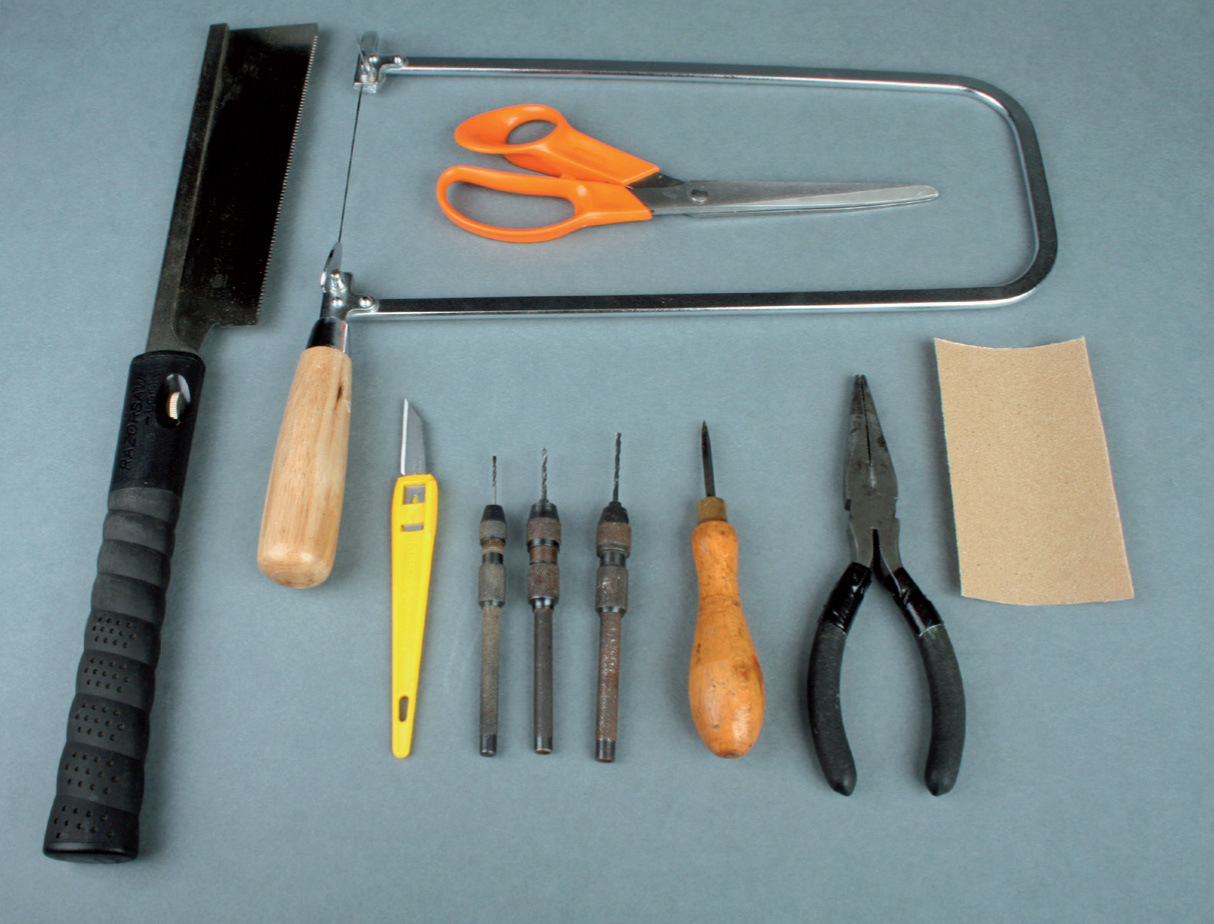 Some useful tools a fine toothed Japanese saw a fretsaw a craft knife - photo 8