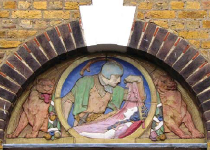 Lunette above one of the windows on the Sidney Street Estate in SomersTown St - photo 3