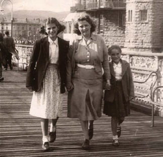 Girls dress resembled female adult styles during the 1940s although white - photo 8