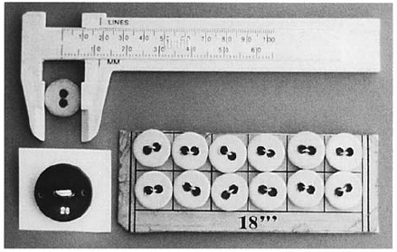 A line measure above a card of linen buttons showing the size and abbreviation - photo 2