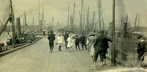 A group of children walking and playing on the Fish Quay at Blyth - photo 4