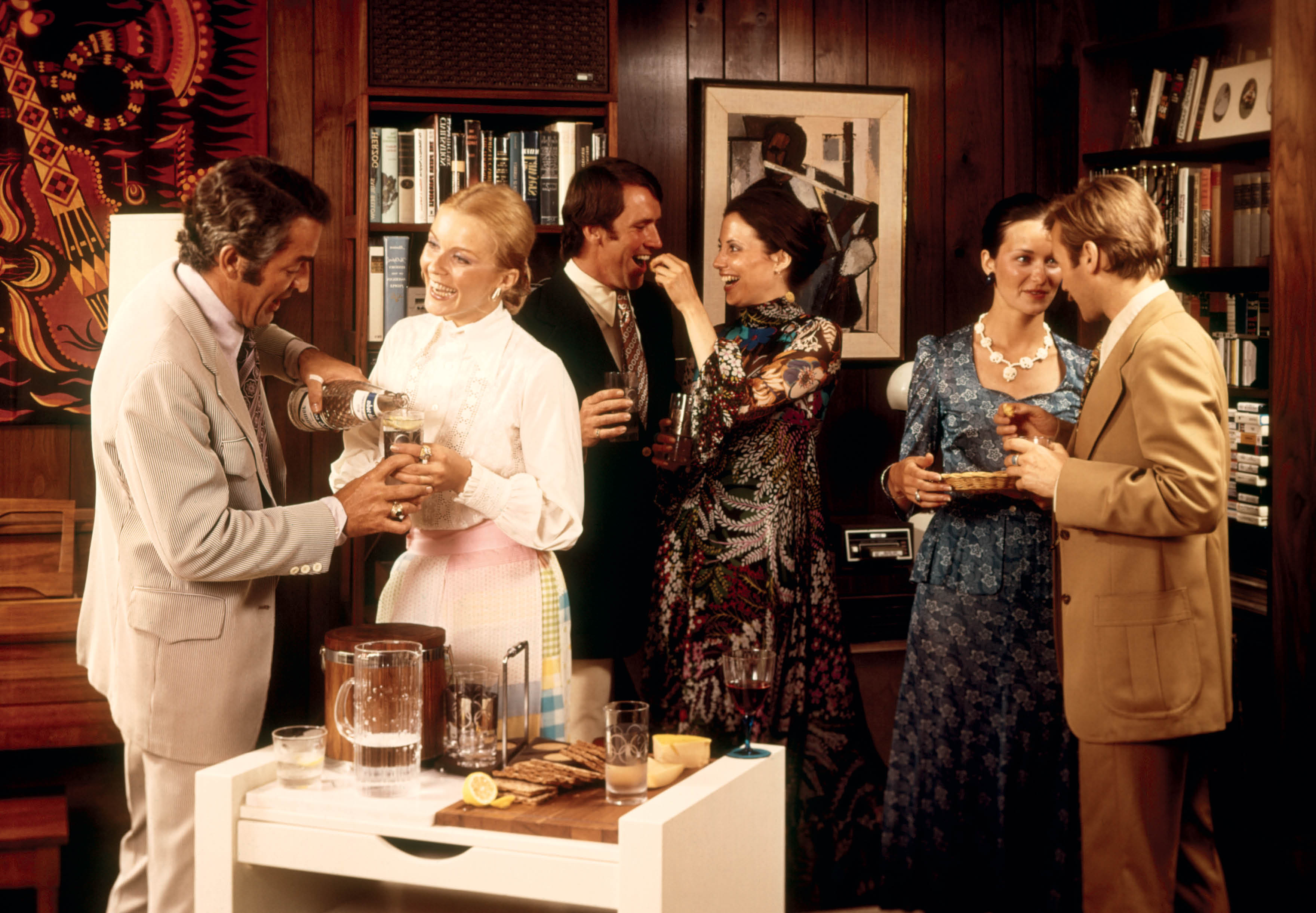 This advertising photograph shows six couples at an intimate at-home party in a - photo 3