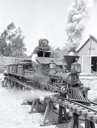 EARL THEISENARCHIVE PHOTOSGETTY Walt Disney worked on a model train in his - photo 1