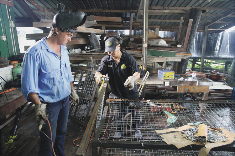 Welding up the traps with one of the wildlife rangers in the workshop shedin - photo 21