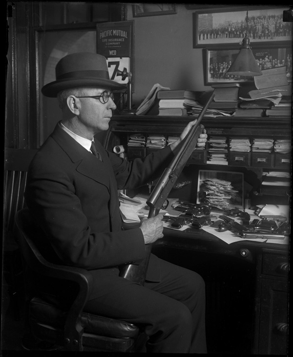 Dec 30 1927 Joliet Police Chief John Corcoran and the guns he confiscated - photo 7