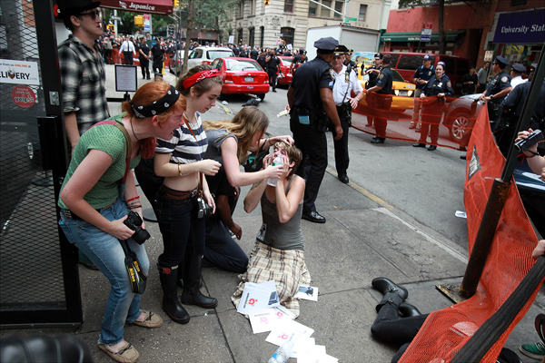 FIGURE 1 Photo of Occupy Wall Street protesters after being pepper-sprayed - photo 2