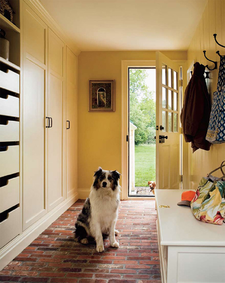 A glass-paneled patio door opens into a spacious entry whose mottled brick - photo 5