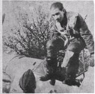 A captured German pilot crapping into the cockpit of his plane in displeasure - photo 4