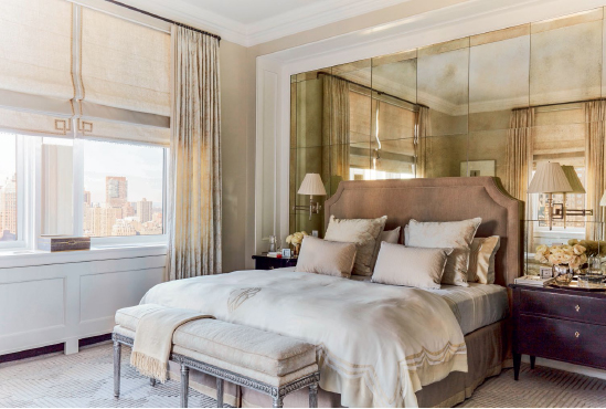 A wall of antiqued mirrors behind the headboard of this Manhattan home by - photo 12