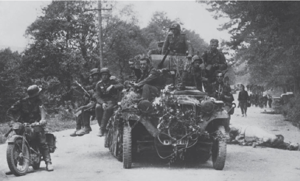 German infantry catch an impromptu ride sitting on the folded-down side panels - photo 2