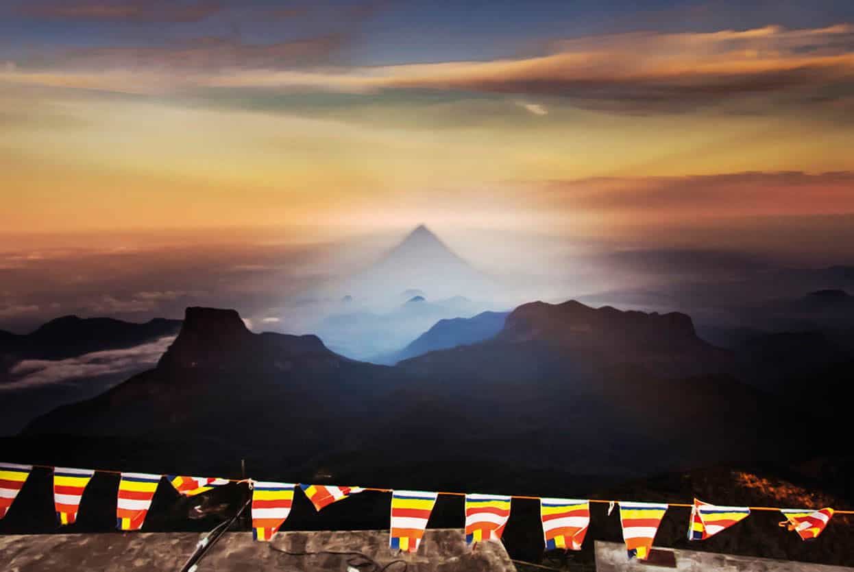 Top Attraction 9 Getty Images Adams Peak See dawns shadow cast from revered - photo 12