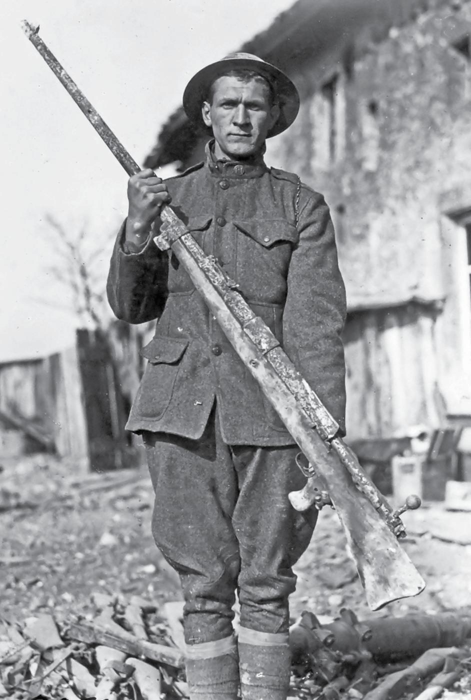 The substantial size of early anti-tank rifles is evident in this photo of a - photo 2