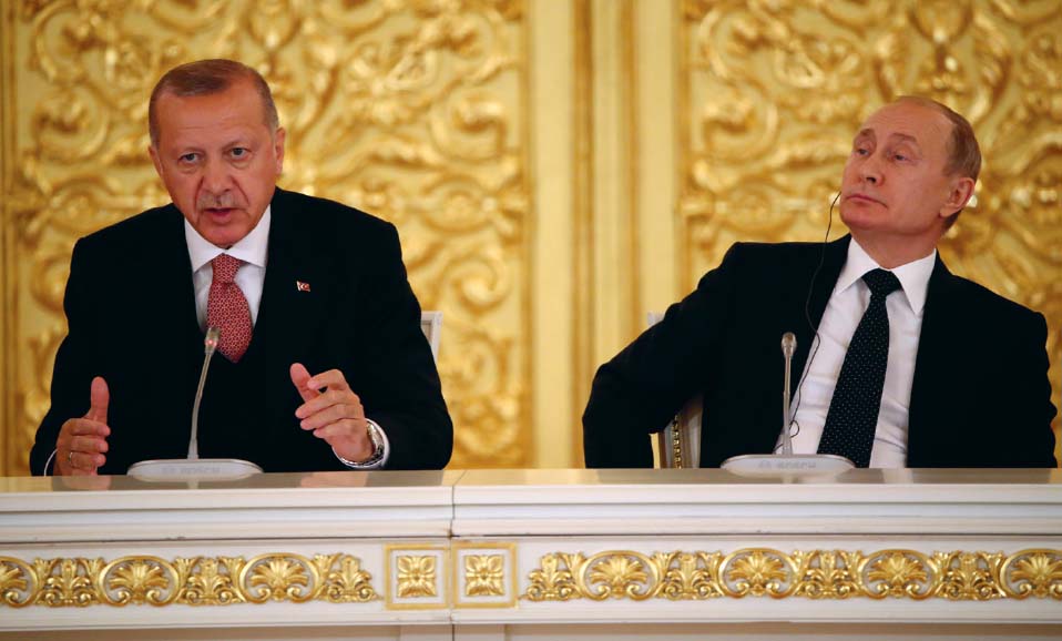 Russian President Vladimir Putin listens as Erdoan speaks during a business - photo 7