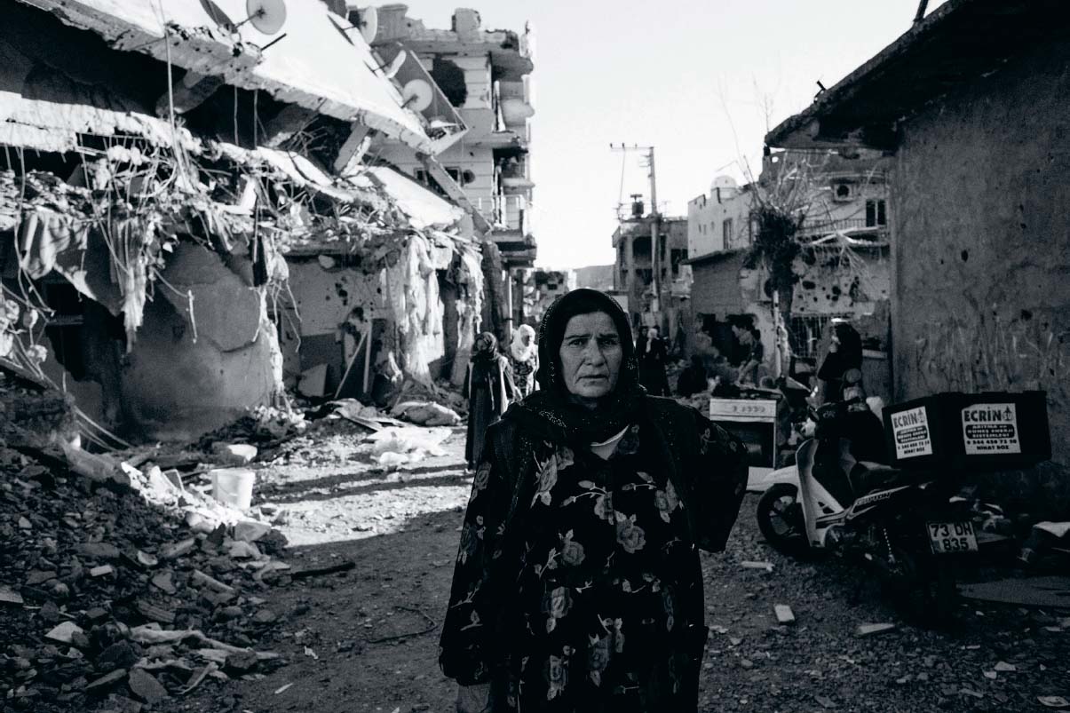 Kurdish woman in a neighbourhood of Cizre south-eastern Turkey destroyed in - photo 12