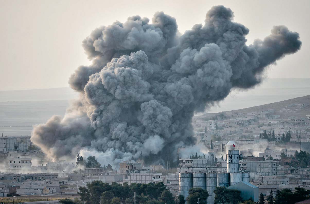 An explosion after a US airstrike hits Koban Syria Cizre with - photo 14