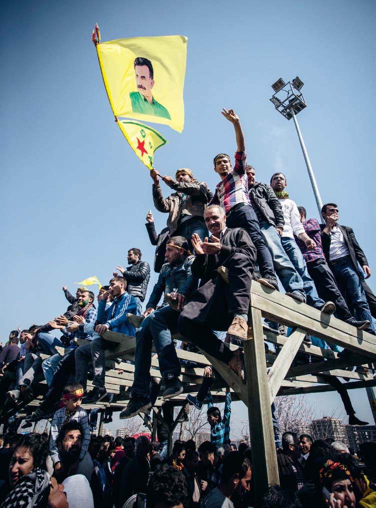 Kurds wave a flag of Abdullah calan as they wait for the announcement of a PKK - photo 20