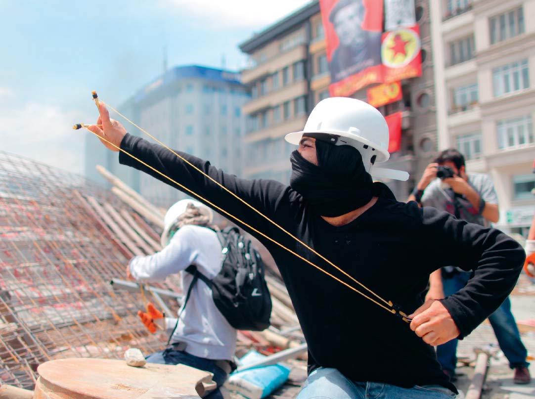 Demonstrators in Istanbul use slings and improvised barricades against the riot - photo 21