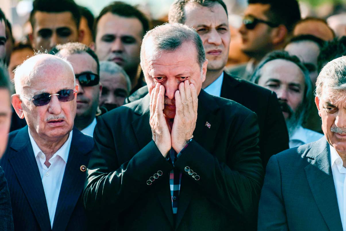 Erdoan cries during the funeral of Erol Olok his long-time friend and spin - photo 25