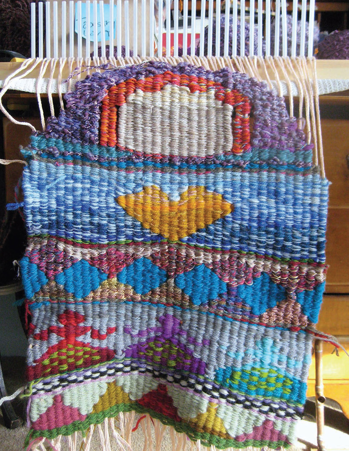 Introduction I first began weaving with peg looms and weaving sticks almost - photo 5