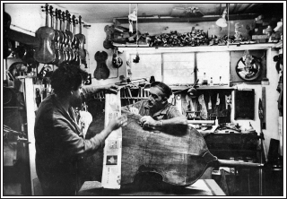 Amnon and Moshe Weinstein repairing a double bass in their workshop ca 1965 - photo 2