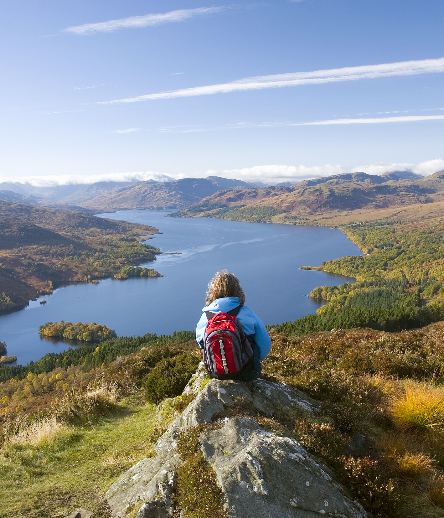 Hiker on the summit of Ben Aan overlooking Loch Katrine DAVID C TOMLINSON - photo 8