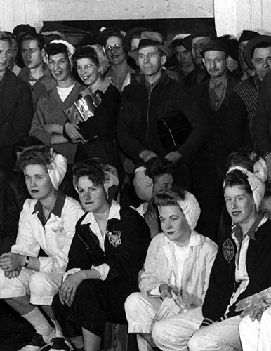 Men and women workers at Vancouver Plywood gather for a union update toward the - photo 9