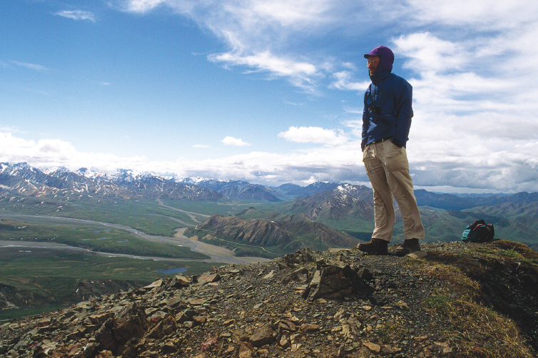 A hiker stands atop Sable Mountain in Denali National Parks Outer Range with - photo 20