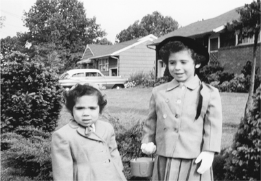 The author right and her sister in front of their ranch-style house in - photo 4