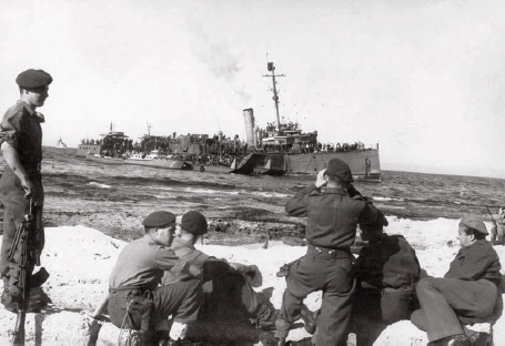 British soldiers carefully watch a ship approaching with illegal immigrants - photo 11