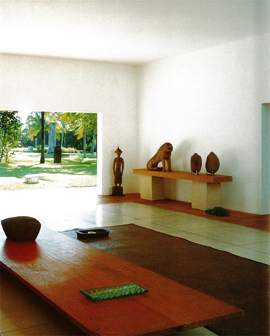 The guest living room in a Japanese art lovers home looks out to a sun-dappled - photo 6