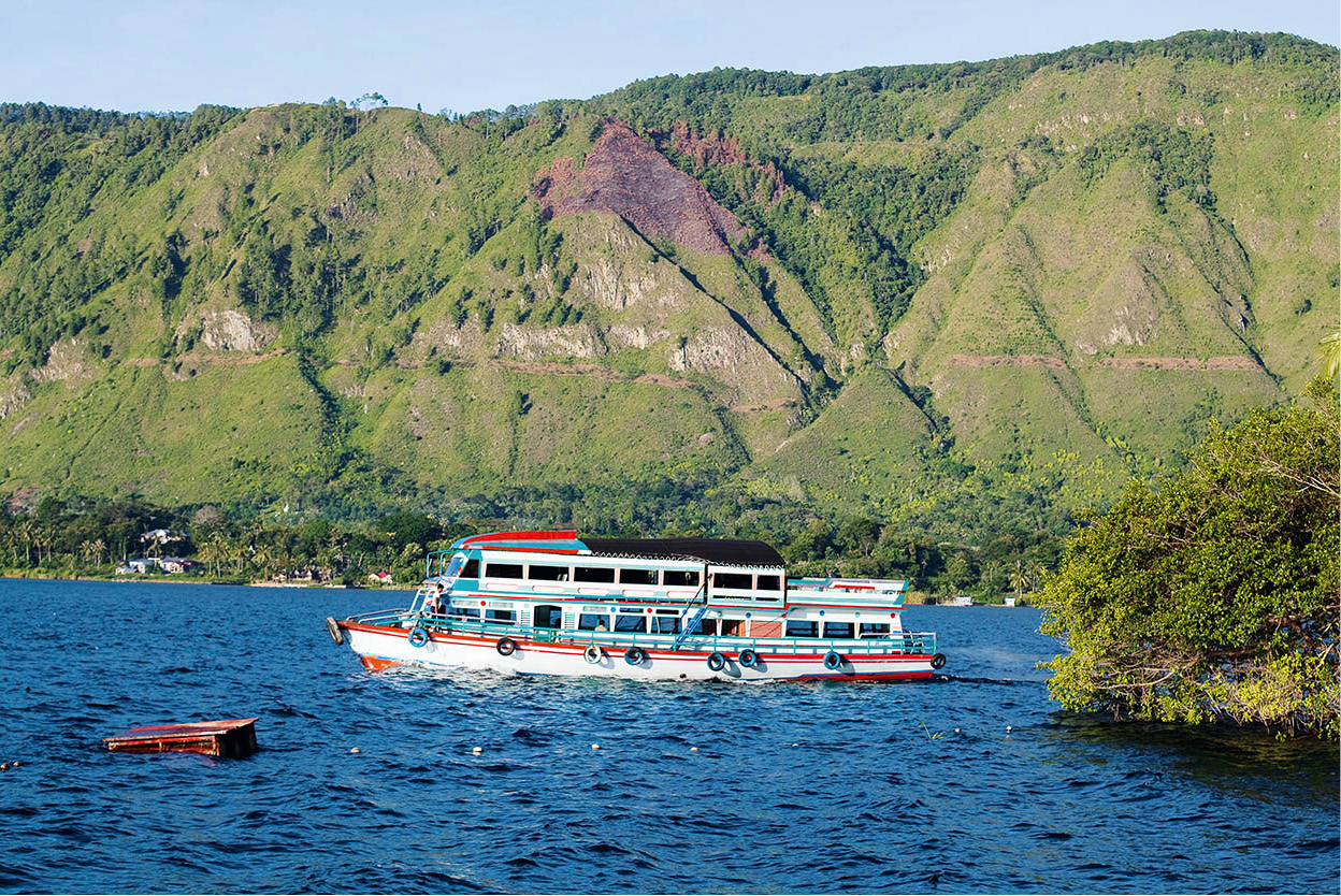 Lake Toba A water-filled ancient caldera the largest and deepest in the - photo 9