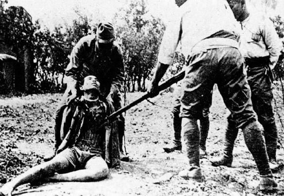 Japanese army recruits at a bayonet drill practicing on Chinese prisoners - photo 3