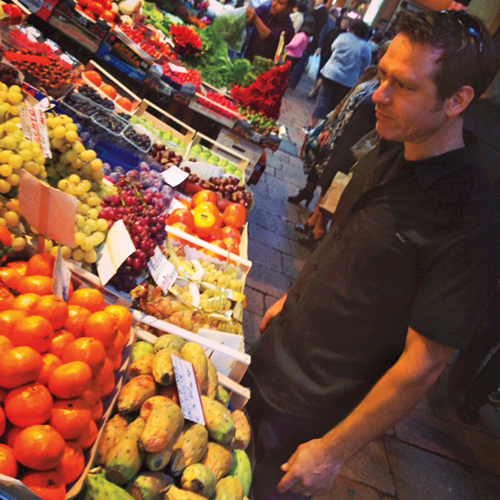 David selects fresh produce at a market in Bologna Italy Historians call - photo 6