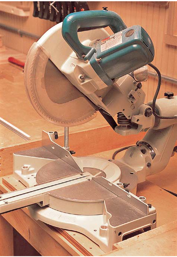 POWER MITER SAW A stationary electric saw used to cut wood either straight on - photo 7