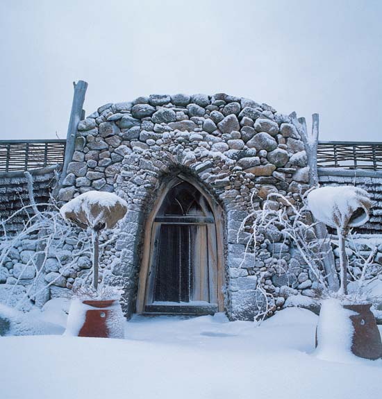 A blanket of fresh snow covers the winter landscape of a walled garden - photo 2