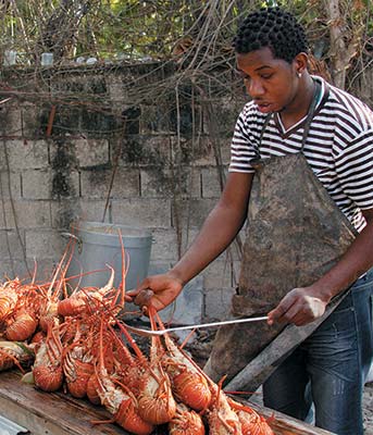 grilling lobster at 3 Dives Jerk Centre in Negril the beach at the mouth - photo 9