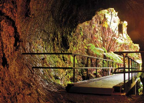 view from inside a lava tube in Hawaii Volcanoes National Park Punaluu Black - photo 11