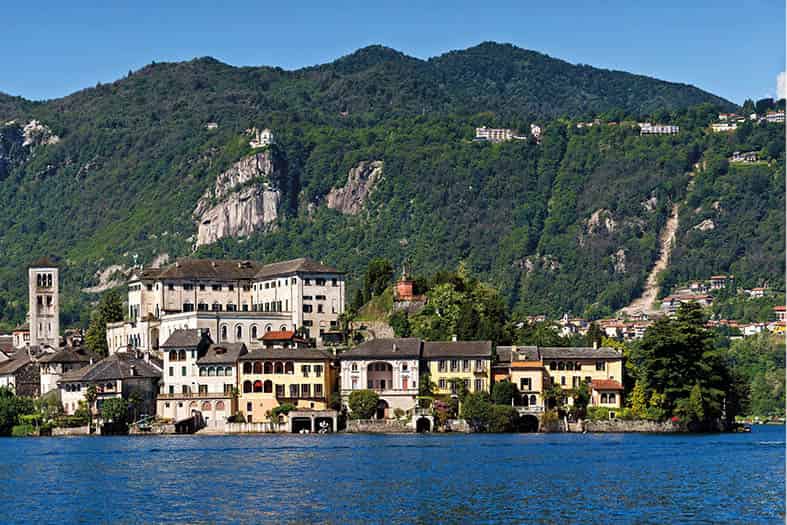 Orta San Giulio A legendary island brightly painted fishing boats and - photo 12