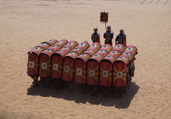 A re-enactment of the testudo formation of Roman warfare as described by - photo 17