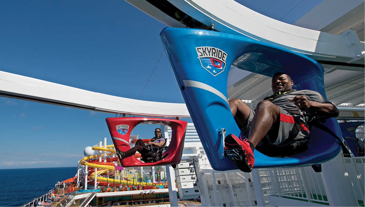 Guests pedaling recumbent bikes high over the deck of the Carnival Vista - photo 27