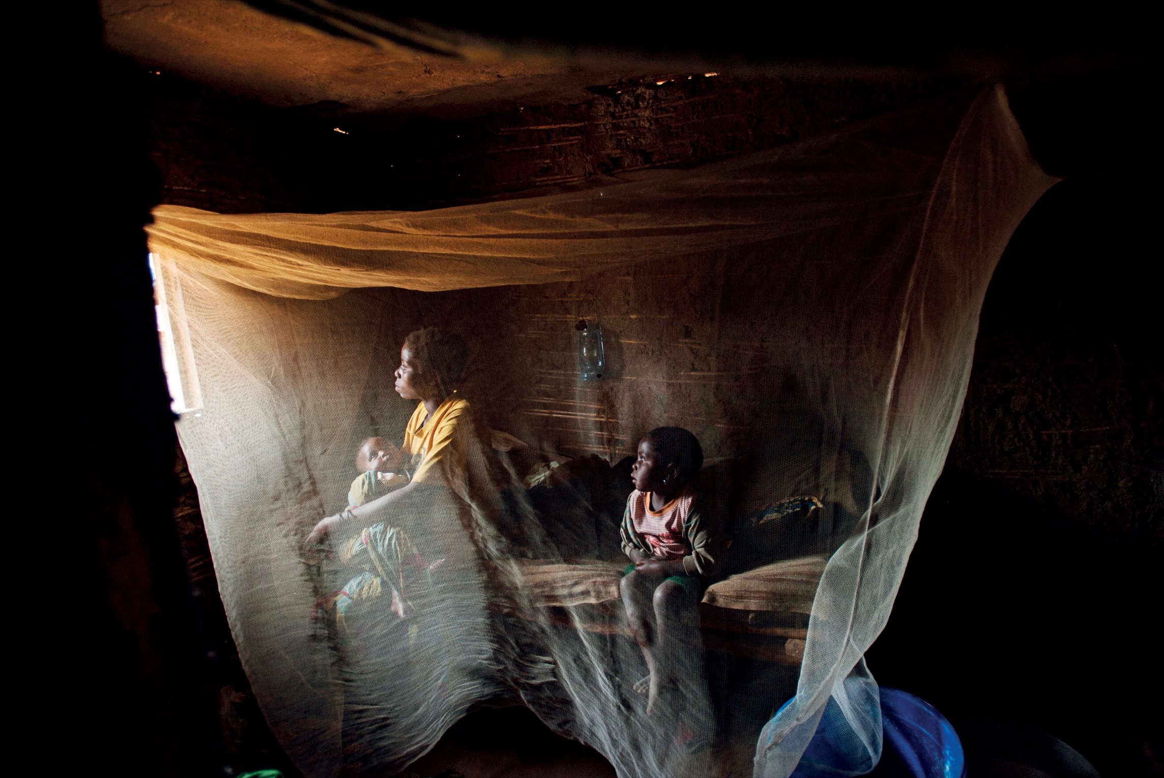 Kahindo twenty sits in her home with her two children born out of rape in - photo 8