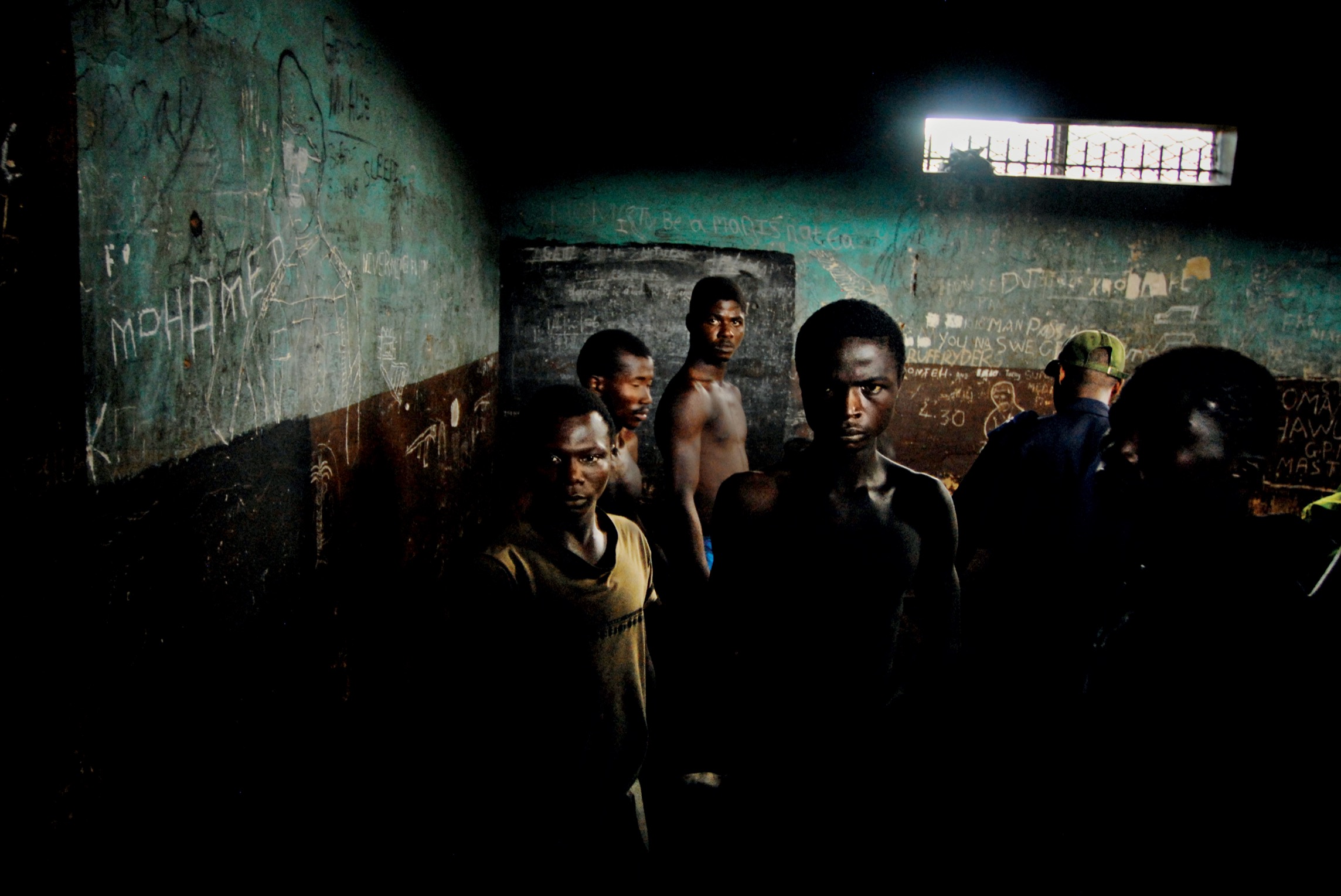 Prisoners wait in the remand section of the Pademba Road Prison in Freetown - photo 9