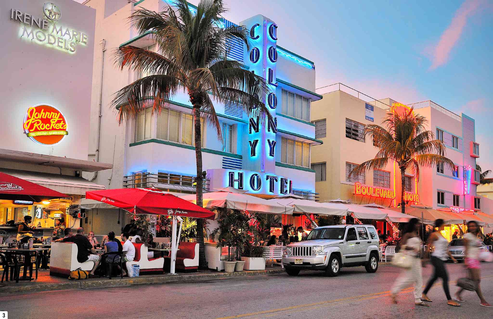 t Neon lights illuminating the street as evening falls over Miamis Ocean Drive - photo 6