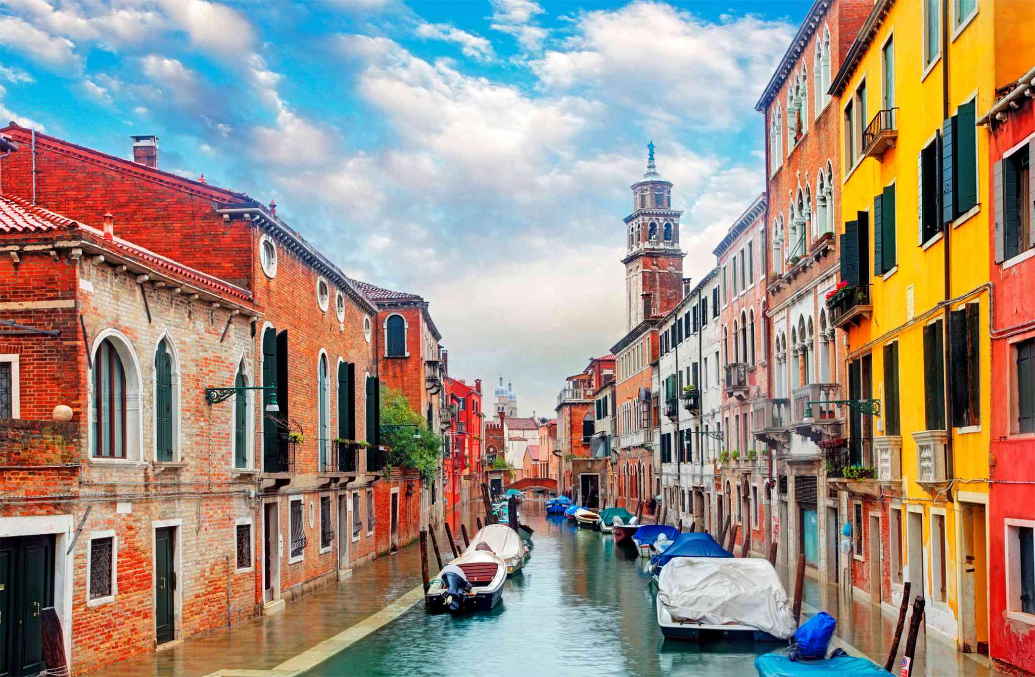 t A picturesque canal in Venice lined with boats Magnificent piazzas - photo 5