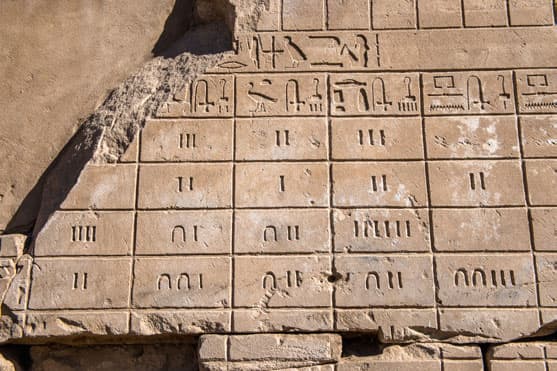 Numbers and marks to show them such as ancient Egyptian hieroglyphics on the - photo 4