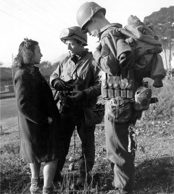 Normandy summer 1944 two US Rangers from either the 2nd or 5th Bn ask a - photo 2